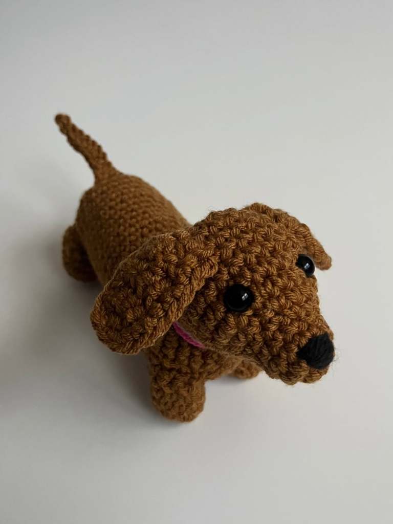 Image of brown crocheted dog.